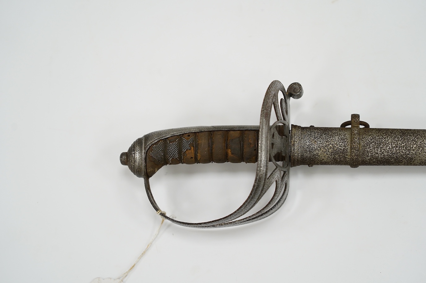 An 1827 pattern Victorian Rifle Officer’s sword, the blade etched with crowned VR and bugle, regulation hilt and scabbard, blade 82.5cm. Condition - poor
